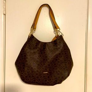 Large Calvin Klein Handbag. Medium Size Tear on Inside Liner and Handle Damage.